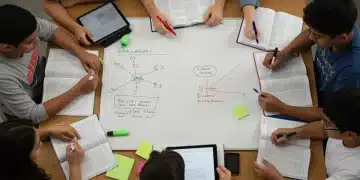 High school juniors preparing for the digital SAT and ACT exams with study materials.