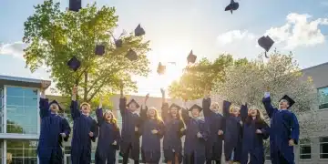 High school graduates celebrating with caps in the air, symbolizing 2026 graduation success.
